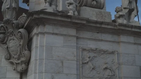 Tilt up shot of Holy Trinity statue in Budapest under blue sky 動画素材 125135426