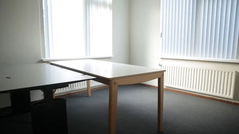 Tilt Shot Inside A Room With Closed Curtains, White Walls And Tables Stock Footage 126700600