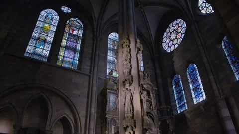 Tilt shot of a large column decorated with intricate carved statues depicting Stock Footage 315409242