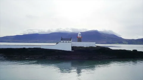 Tilt up shot of lighthouse surrounded by sea Stock Footage 62569191
