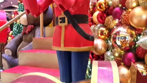 Tilt up shot revealing a christmas nutcracker toy soldier with christmas Stock Footage 223282763