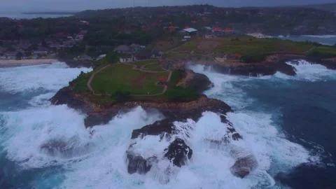 Tilt Shot: Storm at cliffs of Devils Tear (Bali) Stock Footage 200442776