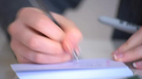 Tilt Shot of a Student Making Flash Cards Stock Footage 90199637