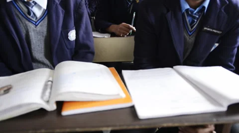 Tilt up shot of students studying in classroom Stock Footage 49855618