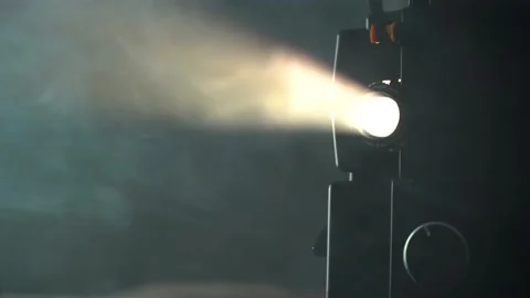 Tilt shot of super 8 camera film projector, smoke and cinematography light Stock Footage 146860478