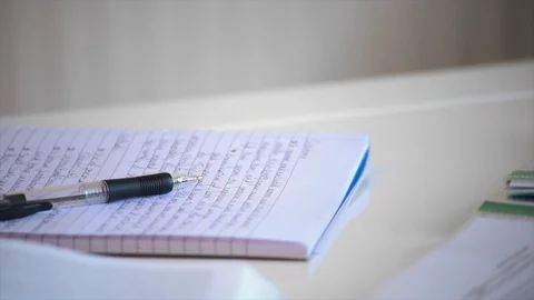 Tilt Shot of Textbook and Notes Stock Footage 90169280