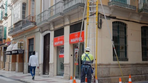 Tilt up shot on two city workers outdoor with yellow vest. Stock Footage 122012183