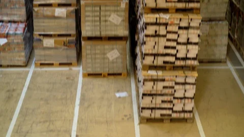 Tilt Shot Of A Warehouse With Sorted Out Pallets Stock Footage 129398939