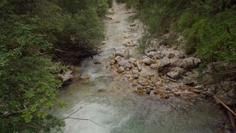 Tilt-up shot of a waterfall to its river Stock Footage 283565813