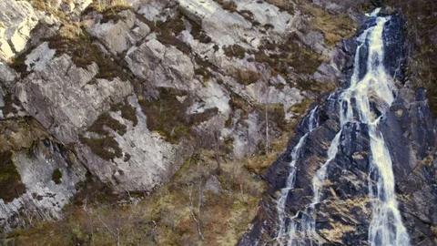 Tilt-up shot of waterfall (Steall Falls, Scotland) Aerial 4K Stock Footage 102856834