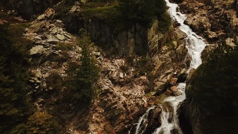 Tilt shot of wild water stream running over rocks in France Stock Footage 116325183