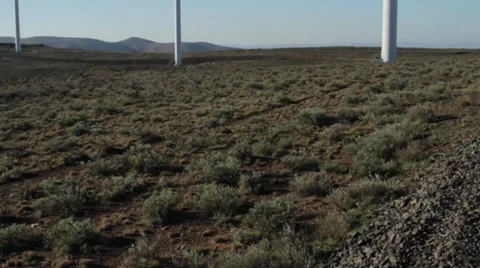 Tilt shot of wind turbines on a clear day in Washington Видео 32244884