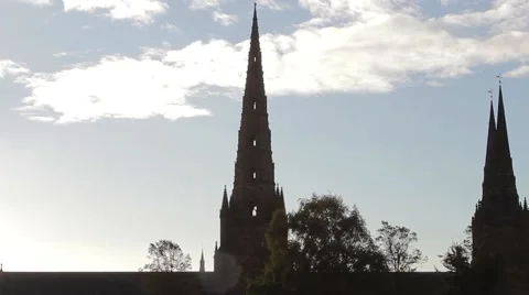 Tilt Silhouette Three Spires Historic Lichfield Cathedral Lens Flare Blue Sky Video stock 42726853