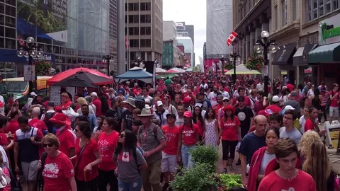 Tilt to the sky from a giant crowd on canada day Stock Footage 77500737