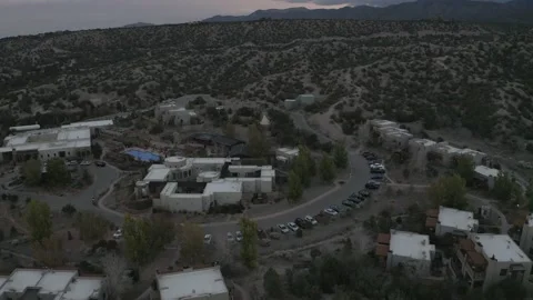 Tilt up from small desert town to cloudy mountains Video stock 167673835