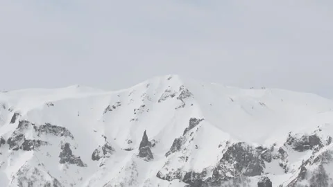 Tilt of a snowy mountain in winter Stock Footage 86091589
