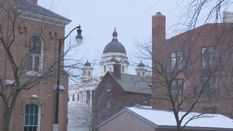 Tilt on Snowy Syracuse Rooftops 스톡 동영상 97587621