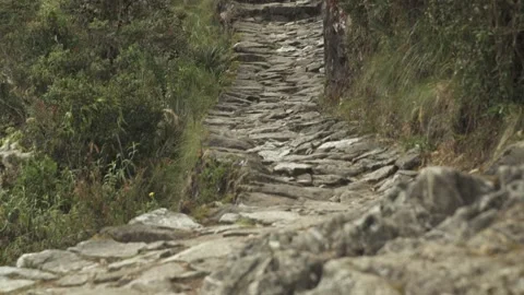 Tilt. Stone path on Inca trail to Machu Picchu. Cusco, Peru Stock Footage 130459337
