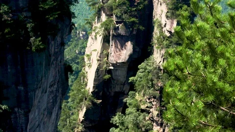 Tilt Up To Stone Piller in Forest Mountain Area in China Stock Footage 120528341