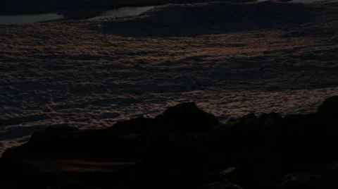 Tilt up to sunset over ice Stock Footage 40450446