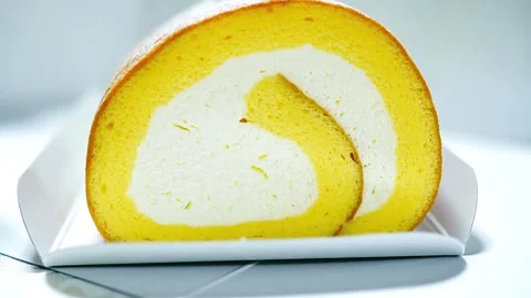 Tilt up Swiss roll or cake roll Stock Footage 305775892