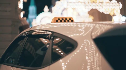 Tilt up of a taxi sign against Moscow panorama Stock Footage