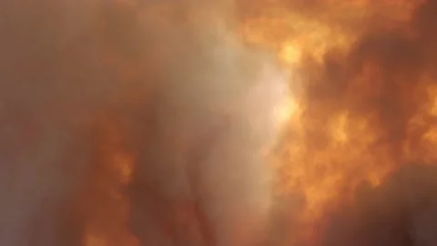 Tilt Up Through Orange Smoke from Fire Video stock 138487033