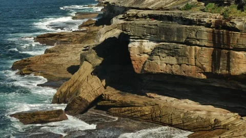Tilt up tourists at Bronte cliffs in Sydney slow motion 4K Stock Footage 275002269