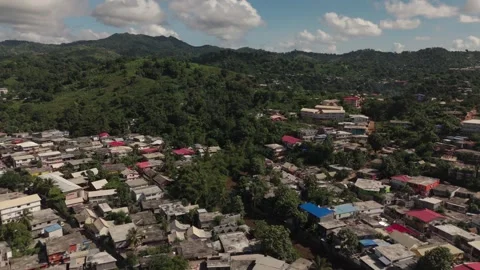 Tilt from Town to blue sky with clouds on tropical island Stock Footage 279493940