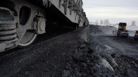 Tilt up tracking shot of freight train with copper ore arriving at the unloading Stock Footage 75068541