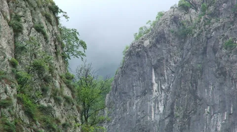 Tilt up on vertical walls of River Canyon Stock Footage 33632584