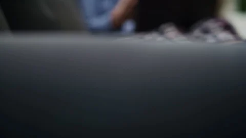 Tilt up video  of man gesturing during a video conference. Stock Footage 128814244