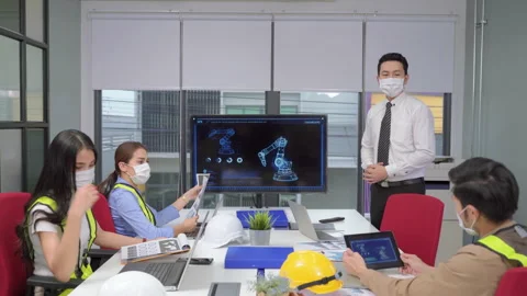 Tilt up video shot of The supervisor of the engineering team is presenting Stock Footage 141184418