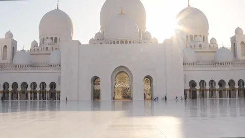 Tilt up view Abu Dhabi, UAE - Sheikh Zayed Mosque by Sunset. Sunflare soft .. Stock Footage 324946090