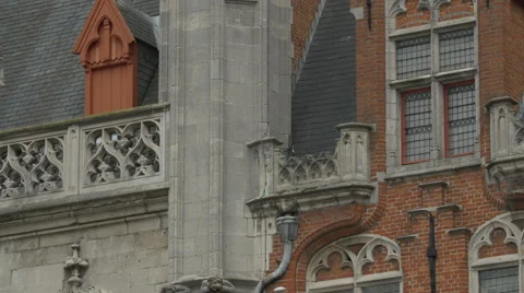 Tilt up view of the decorated Provinciaal Hof's spire in Bruges Stock Footage 59668093