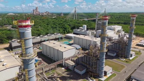 Tilt up view of the Energa 4 power generation facility, fuel storage tanks and Stock Footage 319627757