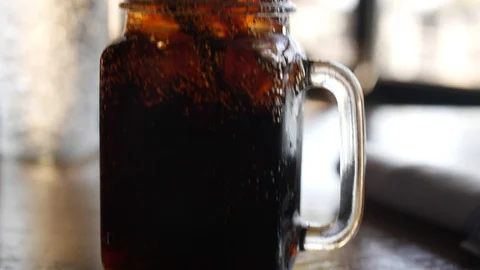 Tilt up view on jar with refreshing ice tea Stock Footage 85725011