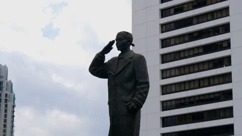 Tilt up view of Jendral Sudirman statue on Sudirman street in Jakarta Stock Footage 238072759