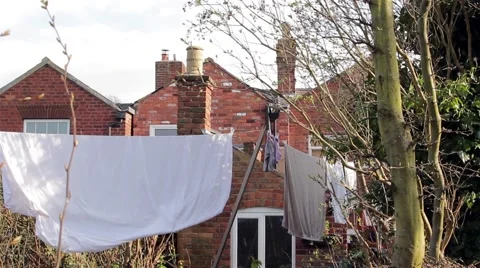 Tilt to Washing Line - Socks, Sheets, Clothes &amp; Towels Hanging in Garden Stock-Footage 49074683