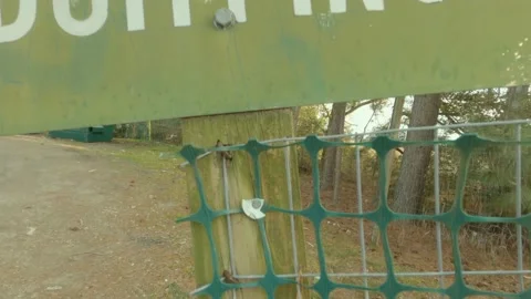 Tilt of a waste trash dump No Out of County Dumping sign Stock Footage 147309032