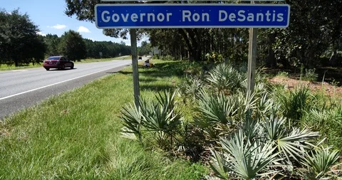 Tilt up wide angle CU Florida border sign Welcome to Florida, Ron Desantis, Gov. Stock Footage 118152242