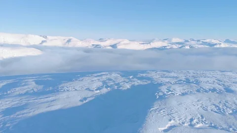 Tilt of Winter scenery with white summits clouds and snow Stock Footage 99739733
