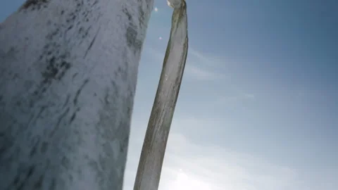 Tilt up from winterized boat to Whale Bones arch at Utqiagvik Barrow Stock Footage 252126846