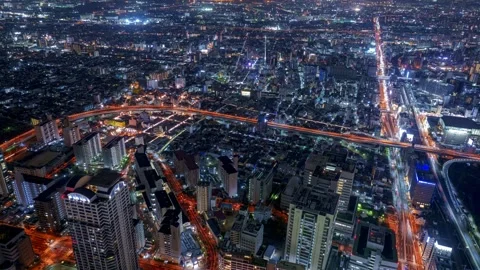 TiltDown Osaka City Night View Timelapse, High Angle Overview and Road Traffic Stock Footage 334557830