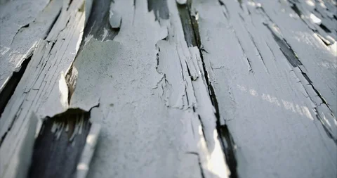 Tilted angle of cracked and chipped white paint on an American Barn Stock Footage 98356155
