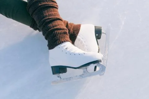 Tilted blue version, ice skates with reflection Stock Photos