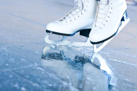 Tilted blue version, ice skates with reflection Stock Photos