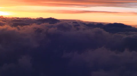 Tilted climbing flight over sunset clouds, passenger POV Stock Footage 59449512