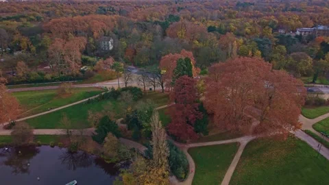 Tilted drone fly over Bois de Vincennes largest public park in Paris with Stock Footage 326636811