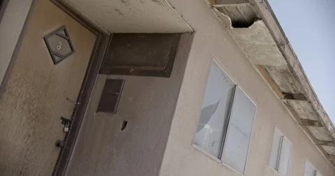 Tilted Dutch Angle on Door of Abandoned Motel Stock Footage 89942929